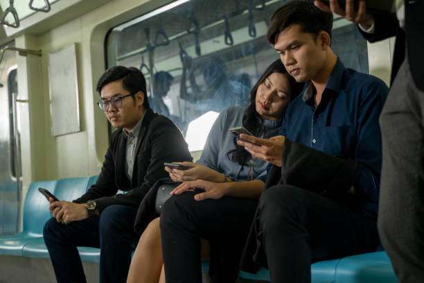 istock Business people sleeping on subway while traveling to work. 1318562343
