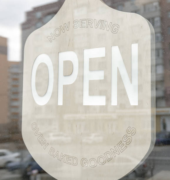 istock Close up inscription open on glass doors. 1318567704