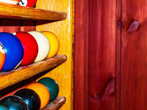 istock Colored billiard balls on a wooden shelf. 1318570191