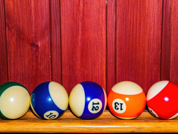istock Colored billiard balls on a wooden shelf. 1318570195