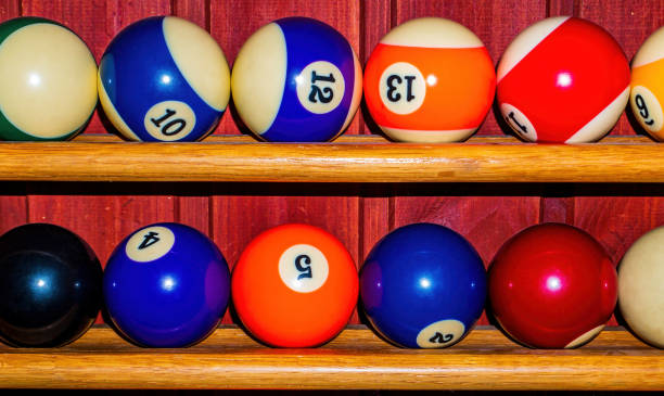 istock Colored billiard balls on a wooden shelf. 1318570203
