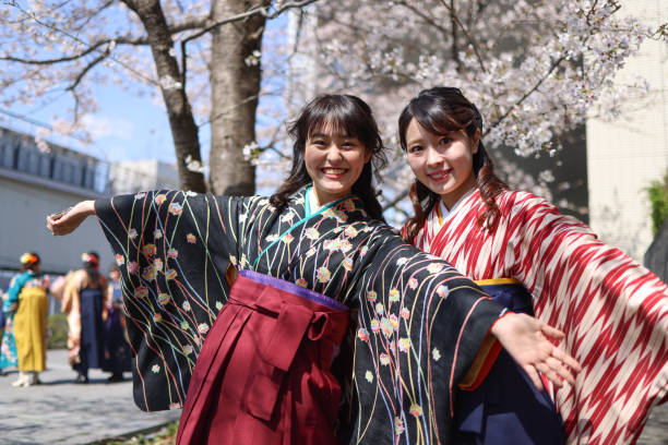 istock Young women student in hakama enjoying graduation 1318570576