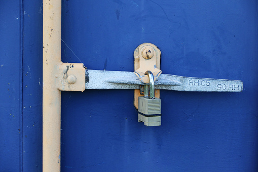 Old metal doors and lock, close-up.