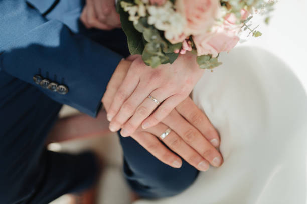 istock Bride and groom holding hands 1318571255