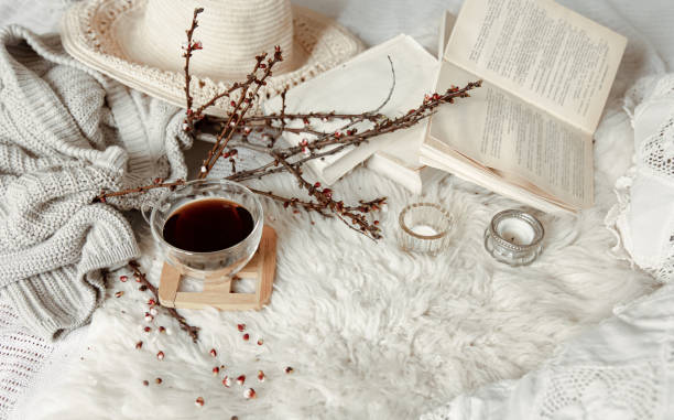 istock Spring composition with a cup of tea, flowering branches and decor details. 1318573038