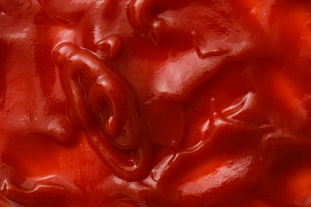 Ketchup sauce texture background Overhead shot of ketchup sauce texture background. healthy eating red above studio shot stock pictures, royalty-free photos & images