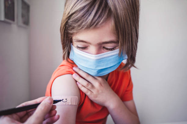 Patient Getting Vaccinated against COVID-19. Child vaccination. Coronavirus epidemic. Copy space. stock photo