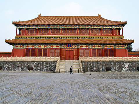 One person in a country of 1.3 billion walking in a courtyard of the Forbidden City.