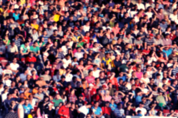 istock Blurred crowd of spectators in a stadium 1318582413