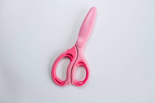istock Pink safe scissors for kids isolated white background. 1318582576