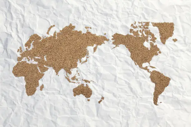 wold map made of wheat grains on textured background