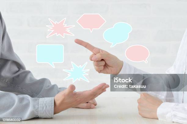 Man And Womans Hands In Qurrel With Speech Bubbles Stock Photo - Download Image Now