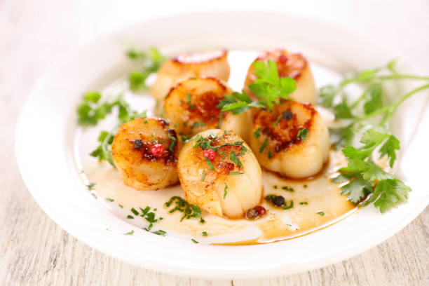 istock seared scallop with herb and sauce 1318583606