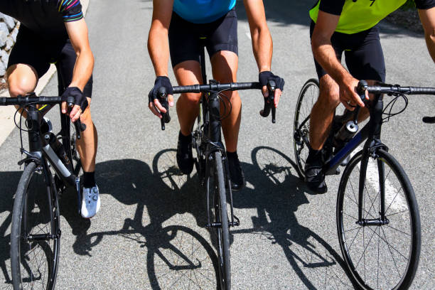 istock Male friends cycling bikes only 1318584302