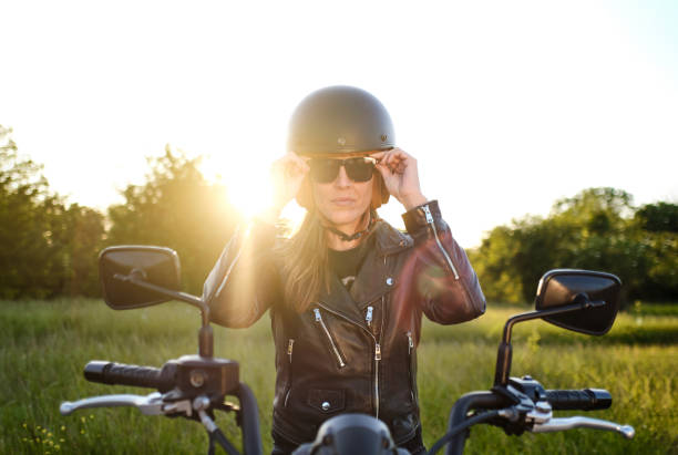 istock woman on motorcycle wearing sunglasses 1318584321