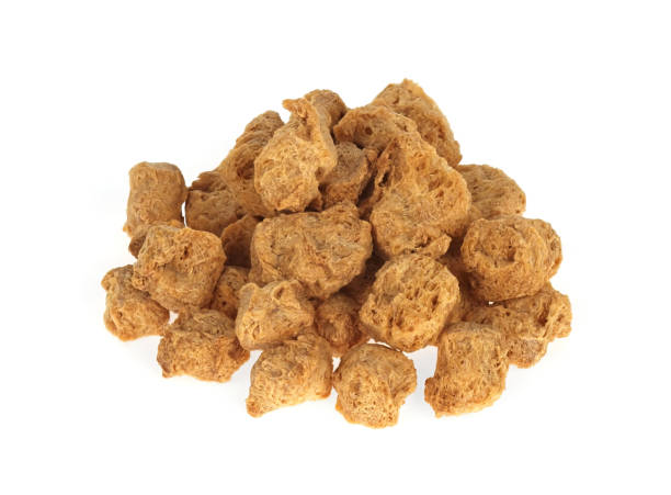 istock Uncooked soy cubes isolated on white. Meat alternative. 1318588046