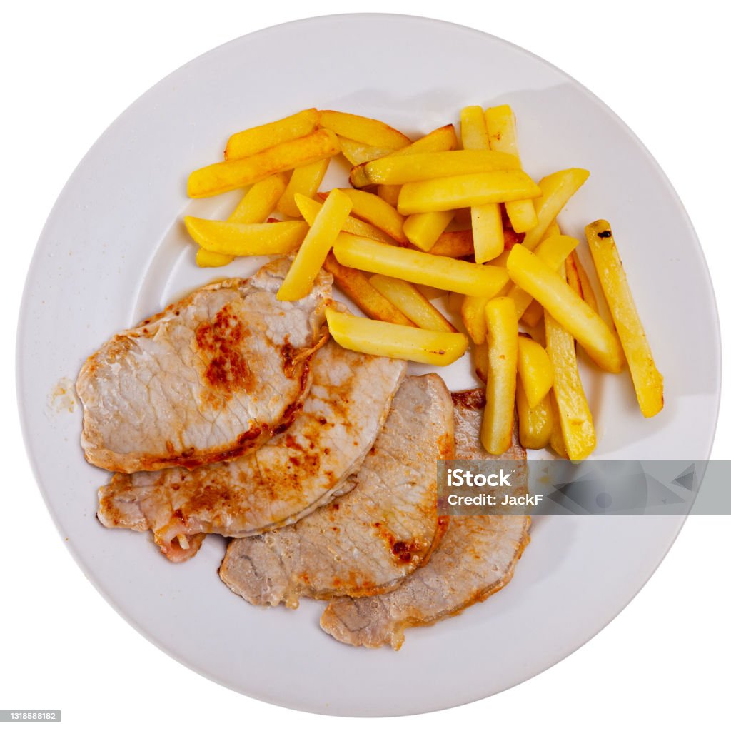 Fried barbecue pork meat with baked potato Roasted pork loin Lomo de cerdo con patata with potatoes fries on a ceramic plate. Isolated over white background Barbecue - Meal Stock Photo
