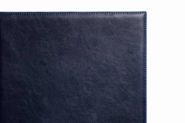 istock Black fine texture of genuine leather. Close-up edge. Blue threds 1318590045