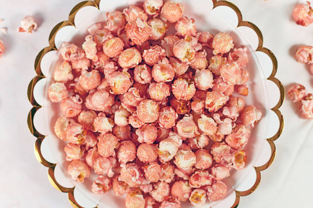 istock Plate with pink colored strawberry flavored sweet popcorn 1318592993