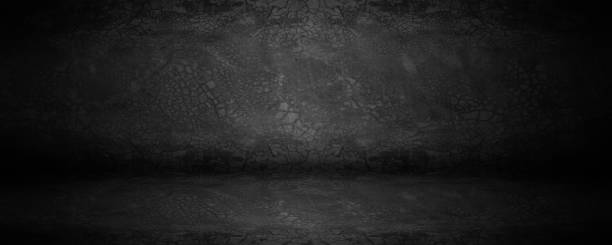 istock Dark board and black cement studio and showroom with shadows and backdrop background 1318593317