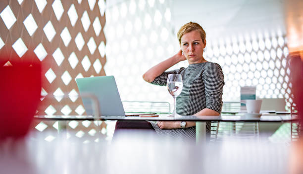 istock Woman looking at laptop in her office 1318597056