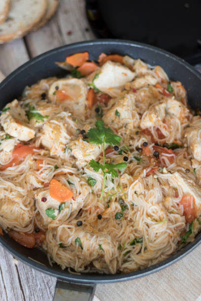 istock Rice pasta with vegetables and meat. 1318598322
