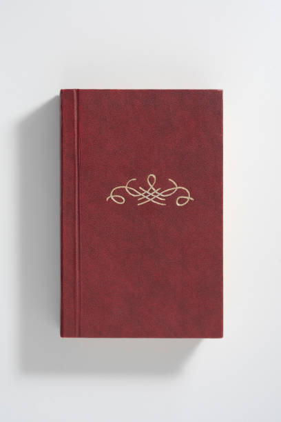 istock An old book with no title. Ornament or monogram and free space for title 1318599200