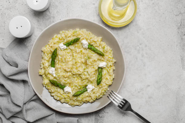 istock Italian risotto with asparagus and caprino cheese. Copy space. 1318599206