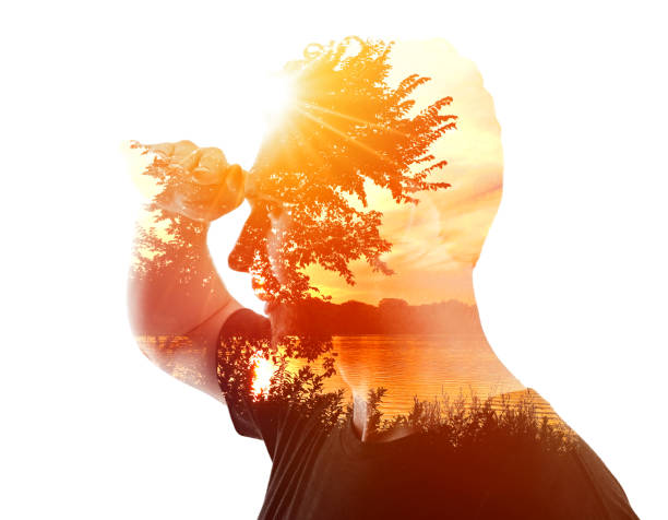 istock Multiple Exposure of young man and lake at sunset 1318599673