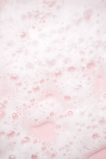 istock White foam bubbles texture on pink pastel background, copy space, banner for loundry, cleaning service, bathroom concept, clean, wash - liquid soap, shower gel, shampoo 1318602137