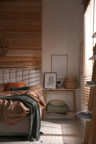 istock Bed with stylish linen and soft pillows in room 1318603357
