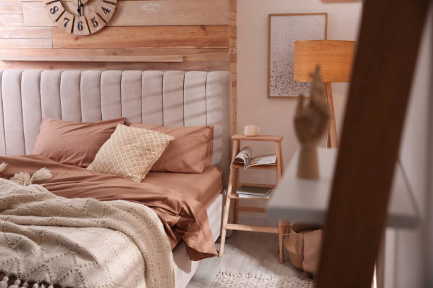 istock Bed with stylish linen and soft pillows in room 1318603572
