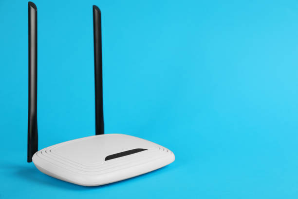 istock Modern Wi-Fi router on light blue background. Space for text 1318604056