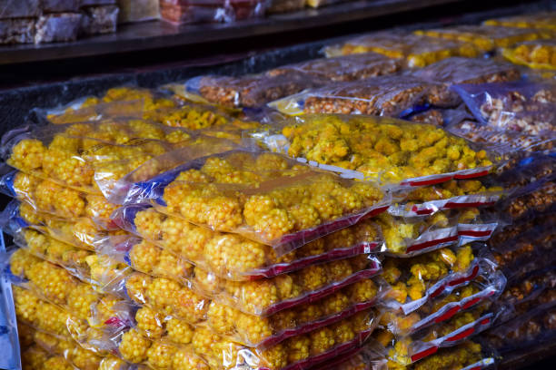 Stock photo of popular sweet dish motichur laddu (sweet dish made up of gram flour and sugar syrup, saffron,dry fruit) packed and kept for sale at Kolhapur maharashtra India. Stock photo of popular sweet dish motichur laddu (sweet dish made up of gram flour and sugar syrup, saffron,dry fruit) packed and kept for sale at Kolhapur maharashtra India. kolhapur stock pictures, royalty-free photos & images