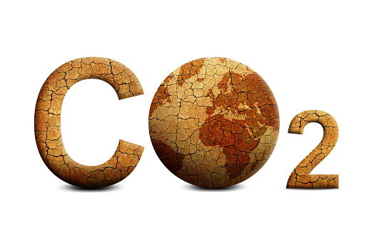 Parched planet earth and text CO2 isolated on white background. Global warming or change climate concept. Environmental problems. Growing Carbon Dioxide in the atmosphere.