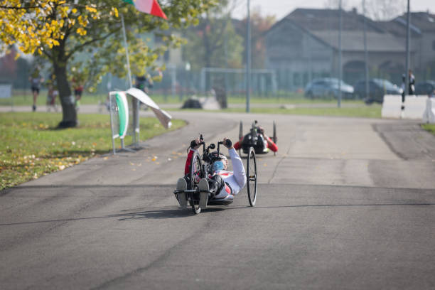 Couple of Disabled Athlete training with Their Hand Bikes on a Track Parma, Italy - October 2020: Couple of Disabled Athlete training with Their Hand Bikes on a Track. paralympic games stock pictures, royalty-free photos & images