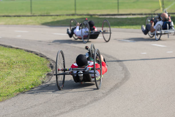 Disabled Athletes training with Their Hand bikes on a Track Parma, Italy - October 2020: Disabled Athletes training with Their Hand bikes on a Track. paralympic games stock pictures, royalty-free photos & images