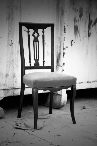 istock Wooden chair in garbage 1318613430