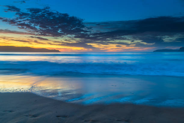 istock Pretty blue summer sunrise seascape with high cloud 1318614084