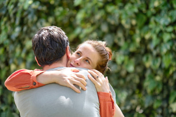 istock Affectionate young couple bonding together outdoors 1318616288