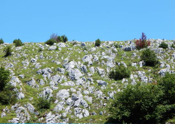 Natural landscape. Rocky mountain towards the clear blue sky