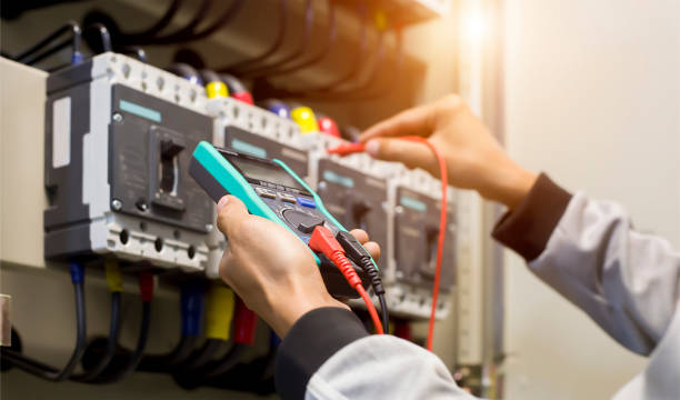 istock Electrical engineer tests the operation of the electric control cabinet on a regular basis for maintenance. 1318616594