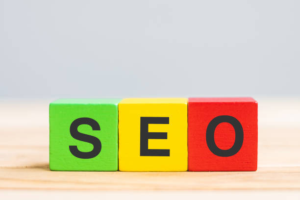 istock SEO (Search Engine Optimization) text wooden cube blocks on table background. Idea, Strategy, marketing, Keyword and Content concept 1318617276