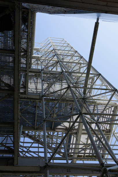 istock Outside geometrical construction with metal staircase on industrial complex 1318620140