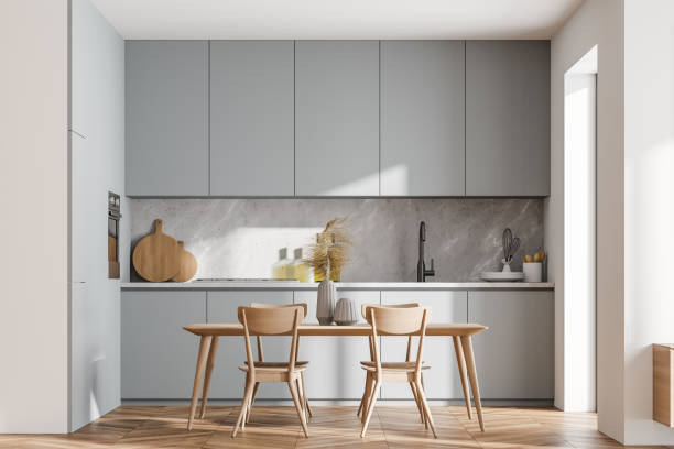 istock Bright cozy kitchen room interior with dining table and chairs 1318620168