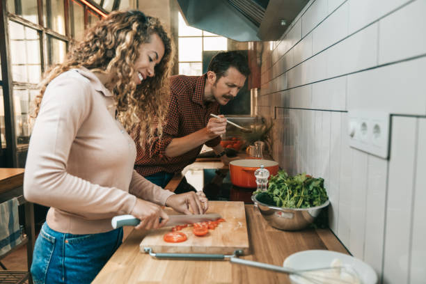 istock Couple cooking in the kitchen 1318620197