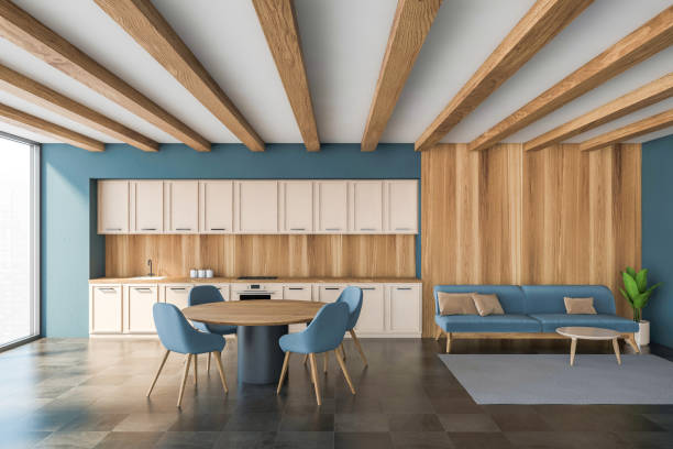 istock Stylish modern kitchen room interior with dining table and chairs. Panoramic window, tile ceramic floor, wooden wall. 1318620695