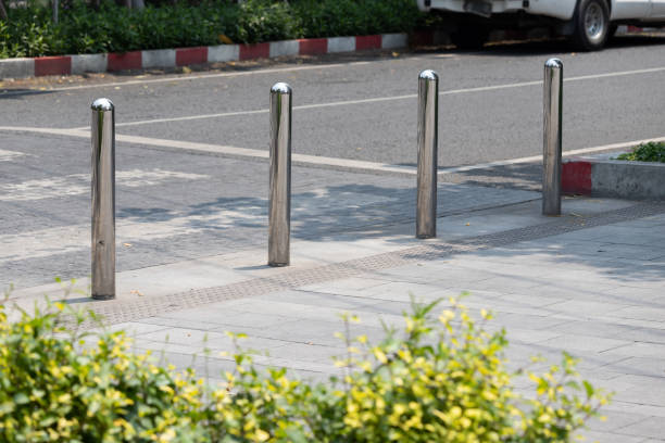 istock stainless steel bollards at concrete pavement. 1318621339
