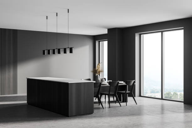 istock Grey kitchen interior with cutting table and chairs near window, concrete floor 1318621771