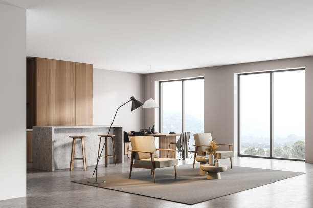istock Light kitchen interior with armchairs, dining table near window, on grey floor 1318622670